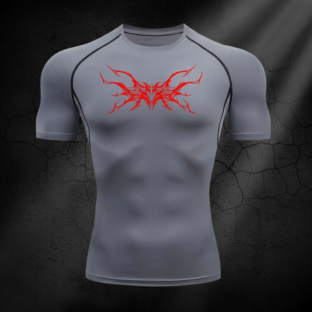 Grey compression shirt with red tribal wings on dark background